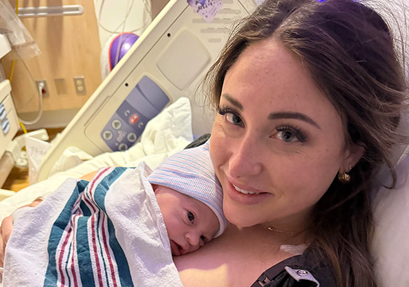 Kendall Nolte holds newborn baby Warren after delivery