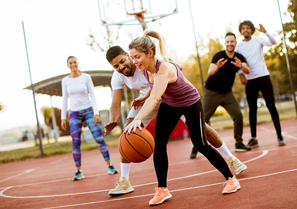 Friends enjoying a game of basketball.