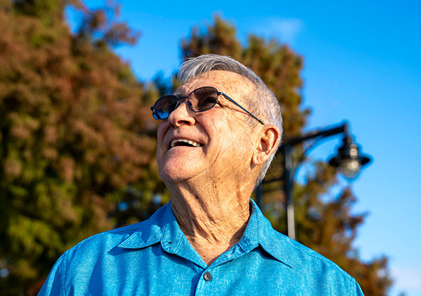 Kenneth Walker standing outdoors, reflecting renewed strength and confidence after heart care.